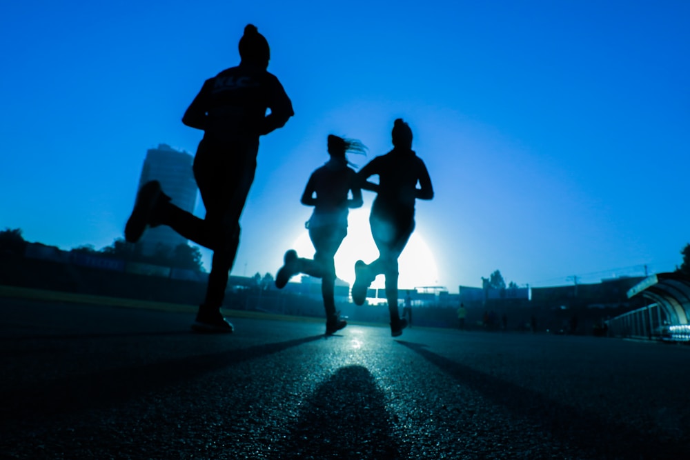 Runner stretching on track